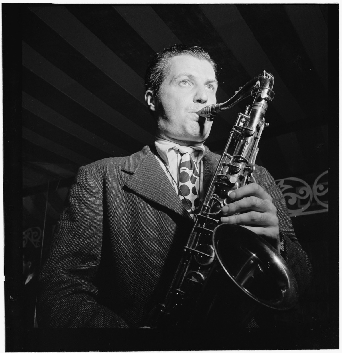 Photo of Charlie Barnet with saxophone